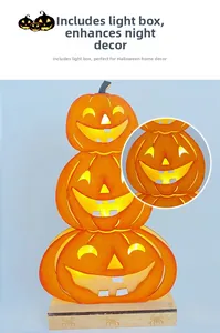 Close-up of three-tier wooden Halloween pumpkin lanterns with warm LED lighting and spider detail
