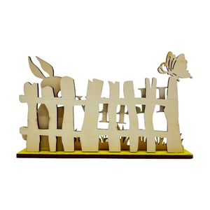 Detail of laser-cut wooden Easter fence decoration with bunny and Happy lettering