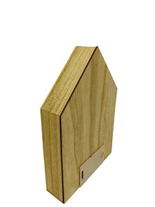 Macro view of the wooden house ornament back featuring a white plastic battery box