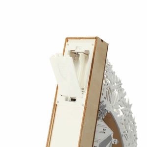 Detail view of wooden Christmas bridge lamp with battery compartment and power switch