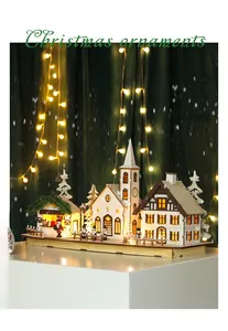Macro detail of wooden Christmas miniature village with warm LED lights and laser-cut houses