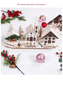 Detailed top view of a wooden Christmas village set with LED lights and festive decorations