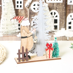 Handcrafted wooden Santa Claus tabletop decoration with mini tree and gift box on wood base