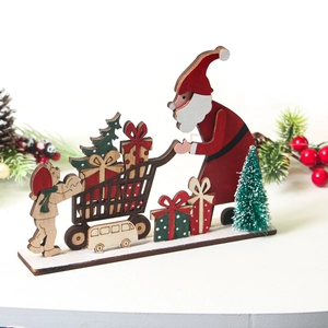 Detail view of a handcrafted wooden Santa Claus cart ornament for festive tabletop decor