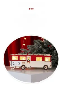 Detailed view of an illuminated wooden Christmas RV caravan calendar with warm LED lights