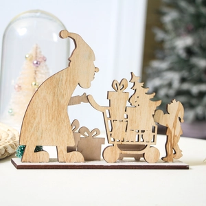 Close-up of wooden Santa Claus ornament with gift cart on a rustic tabletop base