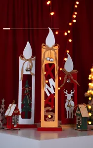 Macro shot of 26cm lighted wooden candle decor with XMAS motifs and festive bells