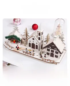 Close-up of wooden Christmas village ornament with LED light and snow-covered miniatures