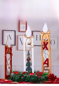 Detail of Christmas wooden candle decor with reindeer, xmas letters and pine needles
