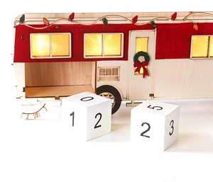 Close-up of LED wooden Christmas caravan advent calendar with countdown blocks