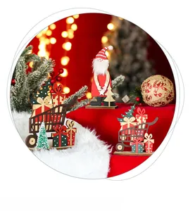 Detailed view of hand-painted wooden Santa Claus and gift cart Christmas ornaments