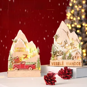 Detailed view of layered wooden Christmas ornament with LED lights and winter scene