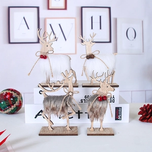 Detail of wooden Christmas reindeer figurines with faux fur, pine cones and bells decorations