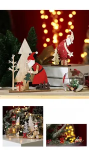 Close-up of wooden Xmas ornament set with hand-painted Santa and tree figures