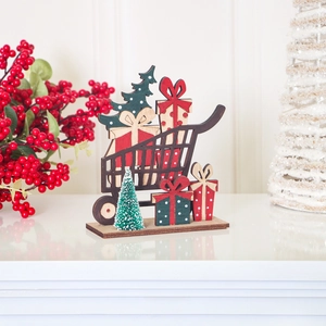 Christmas wooden cart ornament with red gift boxes and green mini tree on white table
