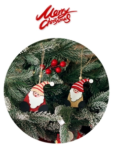 Detail of two-piece wooden Santa gnome ornaments with striped hats and natural rope hangers