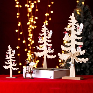 Detailed view of wooden Christmas tree and reindeer set with festive animal prints