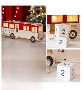 Detail of wooden Christmas advent calendar bus with LED lights and countdown number blocks