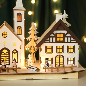 LED wooden Christmas village decoration with illuminated church and festive trees