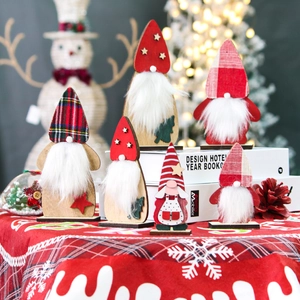 Detailed view of six Christmas wooden gnomes with plush beards on a festive tabletop