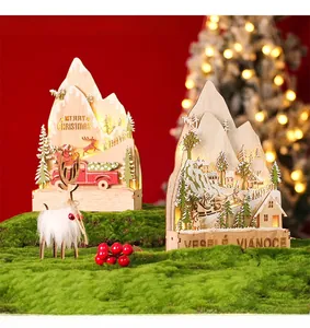 Close-up of LED wooden Christmas decor featuring carved reindeer and snowy forest detail