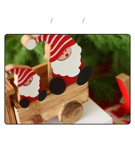 Close-up of hand-painted wooden Santa ornament with natural wood grain detail