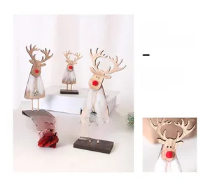 Detail of wooden Christmas reindeer trio with red pom-pom nose and silver star pendant