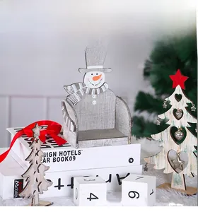 Detail of wooden snowman chair figurine with grey wood grain and holiday decor