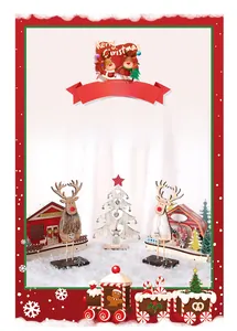 Detail of Christmas wooden reindeer figurines and carved tree on white faux fur carpet
