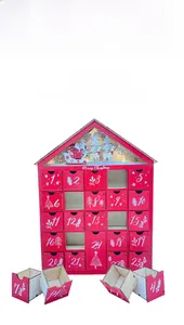 Close-up of 24 small pull-out drawers on a red wooden house-shaped Christmas advent calendar