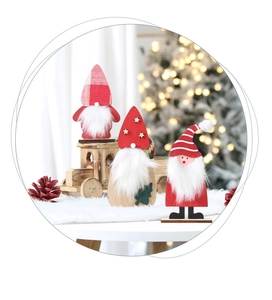 Close-up of wooden Christmas gnomes with felt hats and soft faux fiber beards