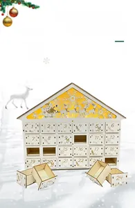 Close-up of wooden advent calendar house with LED lighting and 24 storage drawers