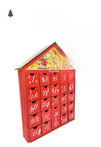 Detail of wooden Christmas advent calendar with 24 drawers and LED light-up scene