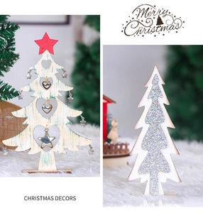 Detail of Nordic wooden Christmas tree desk ornaments with cutout stars and silver glitter decor