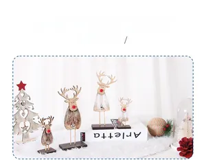 Detailed view of wooden Christmas reindeer figurines with faux fur and bell accents