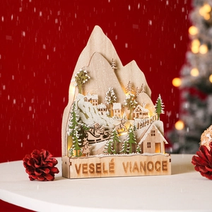 Luminous wooden Christmas village scene with LED lights and Santa sleigh silhouette decoration