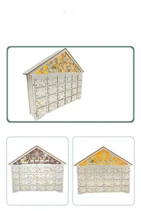 Macro detail of wooden Christmas advent calendar house with 24 drawers and LED forest scene