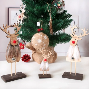 Three minimalist wooden Christmas reindeer figures with faux fur collars and metal pendants