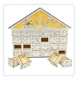 Macro view of white wooden Advent calendar drawers with 24 gold numbered compartments