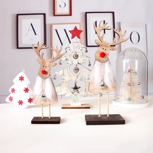 Christmas wooden reindeer set with white fur decor and a star-topped tabletop tree