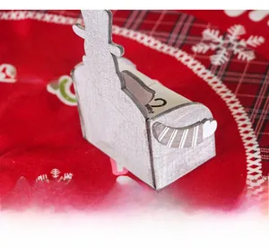 Detail view of a 24cm wooden Christmas snowman desk calendar with date blocks and stripes