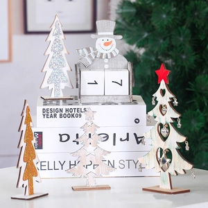Wooden snowman advent calendar with glittery Christmas trees for festive tabletop decoration
