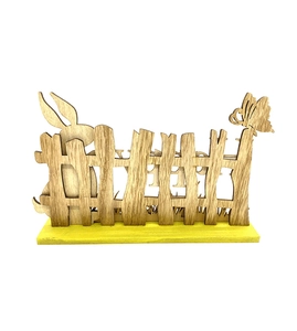 Detail of wooden Easter Happy ornament with laser-cut rabbit and butterfly motifs