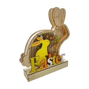 Detail view of multi-layered wooden Easter bunny ornament with festive laser-cut patterns