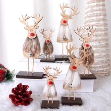 Set of six festive wooden reindeer ornaments with grey faux fur and silver bells for decor