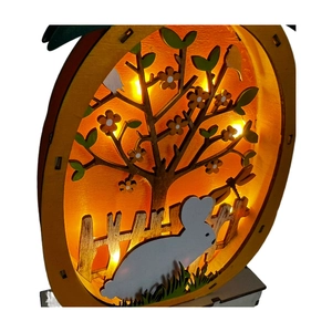 Detailed view of LED wooden Easter decoration with multilayered rabbit and floral design