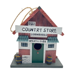 Detail of red wooden birdhouse with Country Store design and hanging rope for garden
