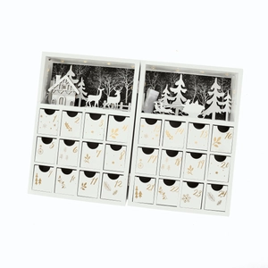 Detail of white wooden advent calendar book with 24 gold numbered drawers and LED lighting