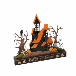Detail of wooden Halloween haunted house tabletop decor with Happy Halloween base