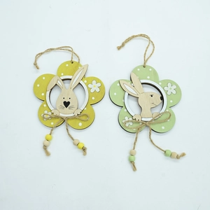 Detail of wooden Easter pendants with rabbit and flower motifs including twine and beads
